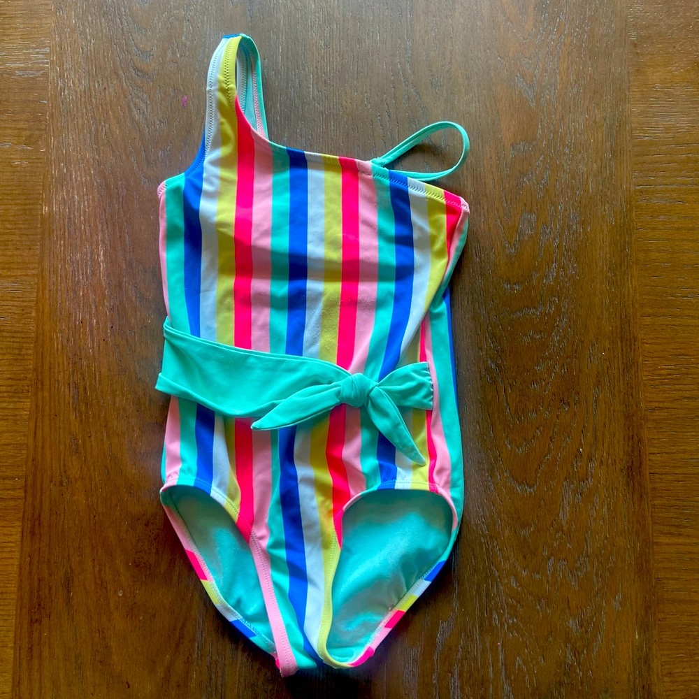 2/$20 Girls 1-piece swimsuit, tie detail in front, 1-shoulder option. Justice.